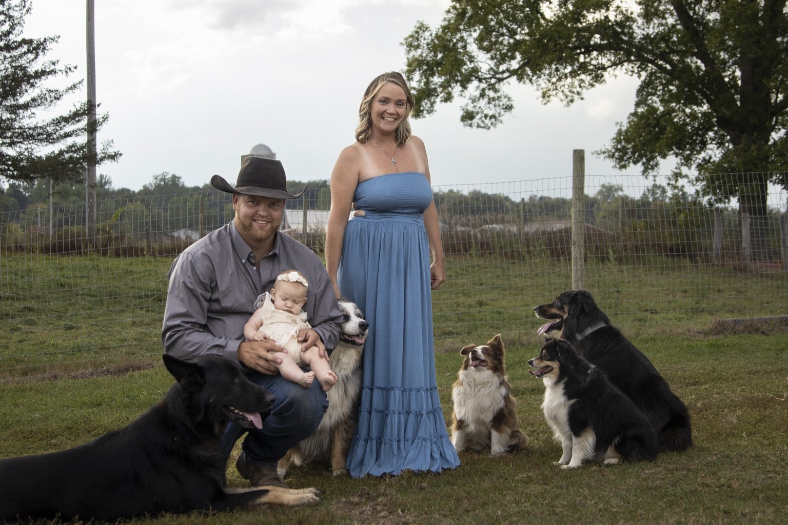 Rockin M family with their dogs on the farm